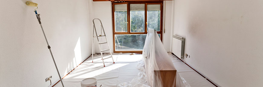 Home interior with furniture covered ready for decorating