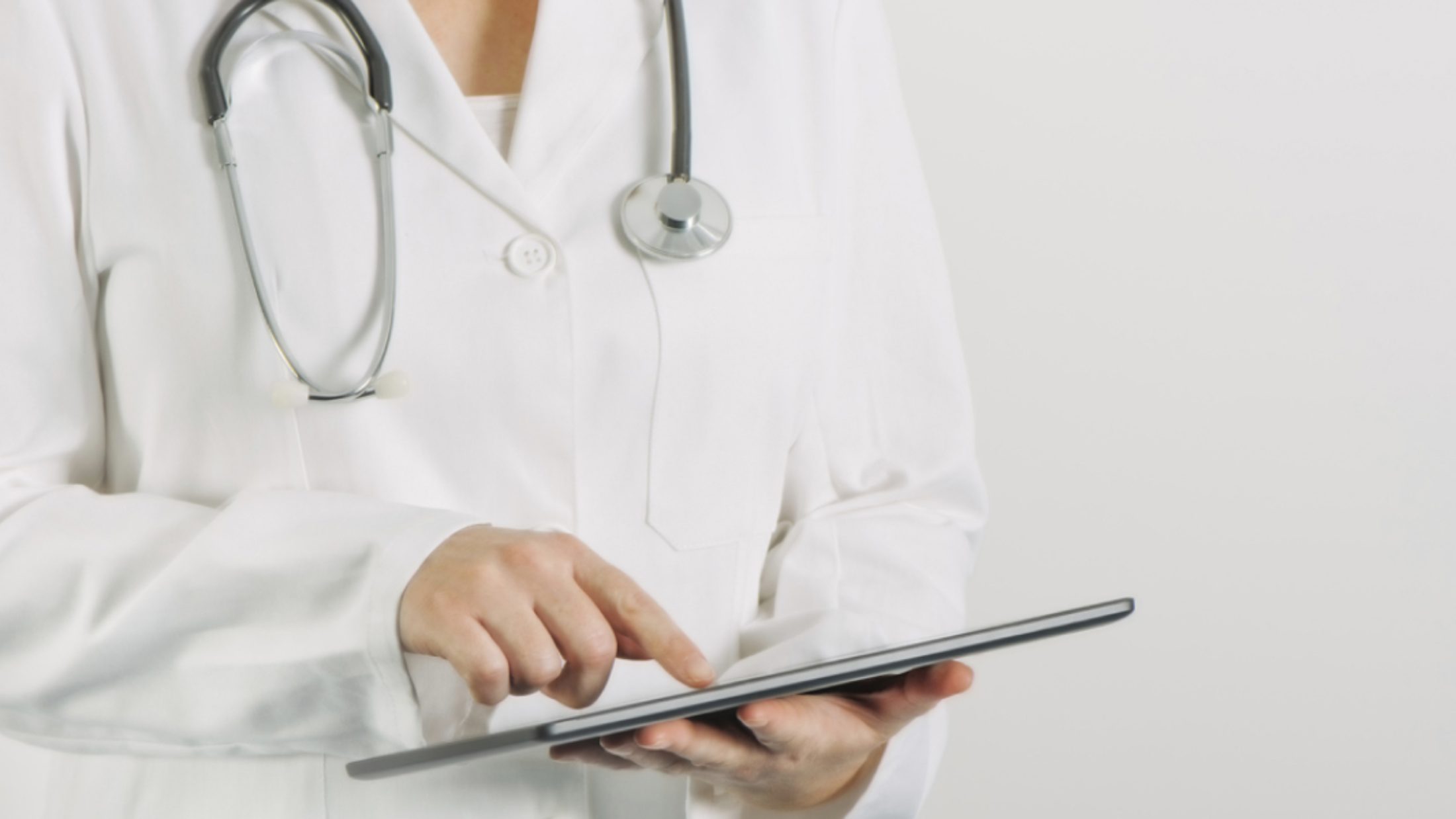 A doctor using a tablet