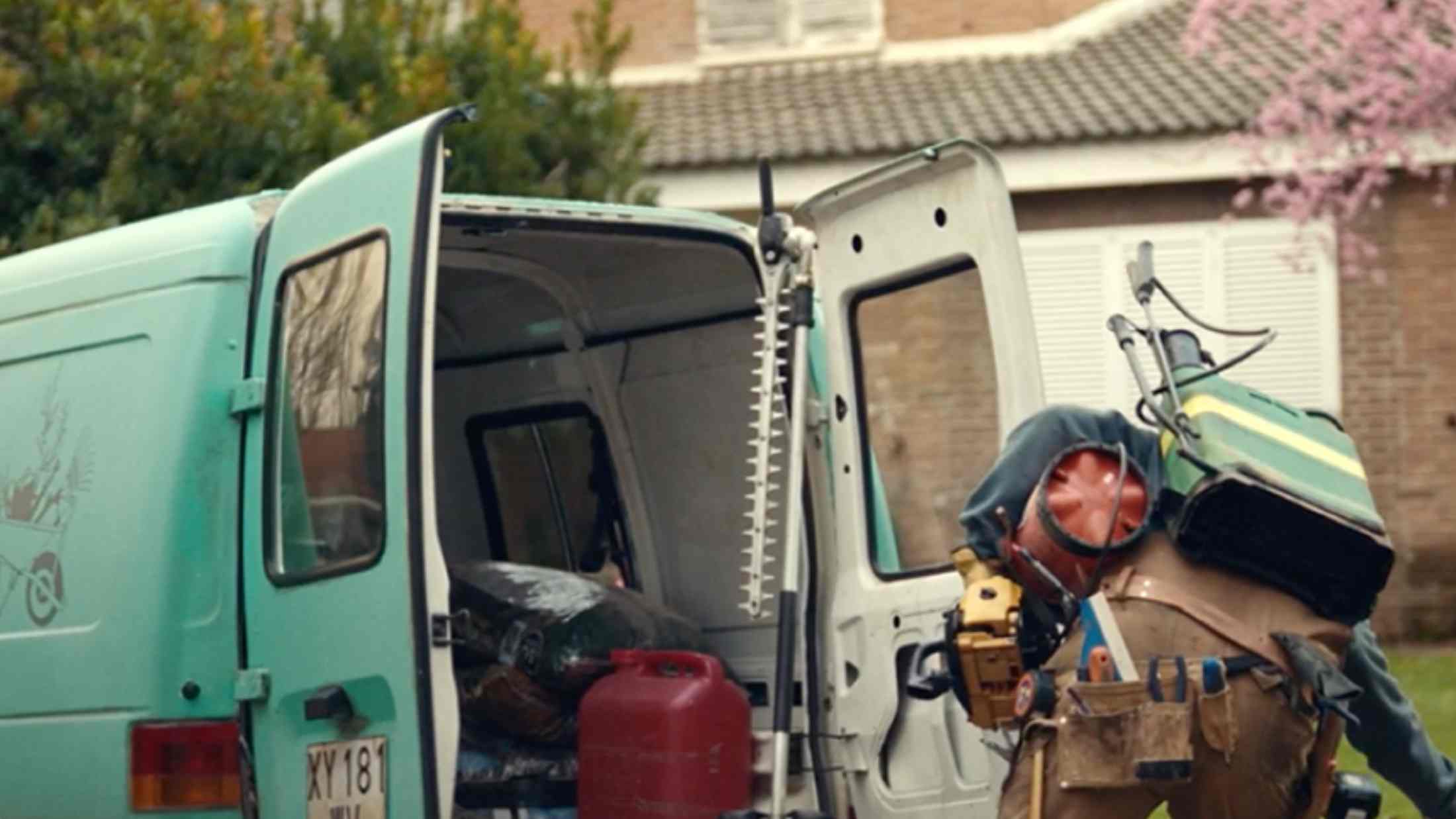 A houskeeper moving his equipments from his car