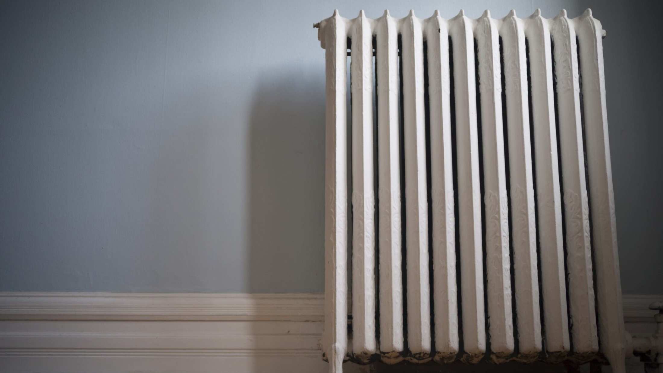 Old cast iron radiator at surface level