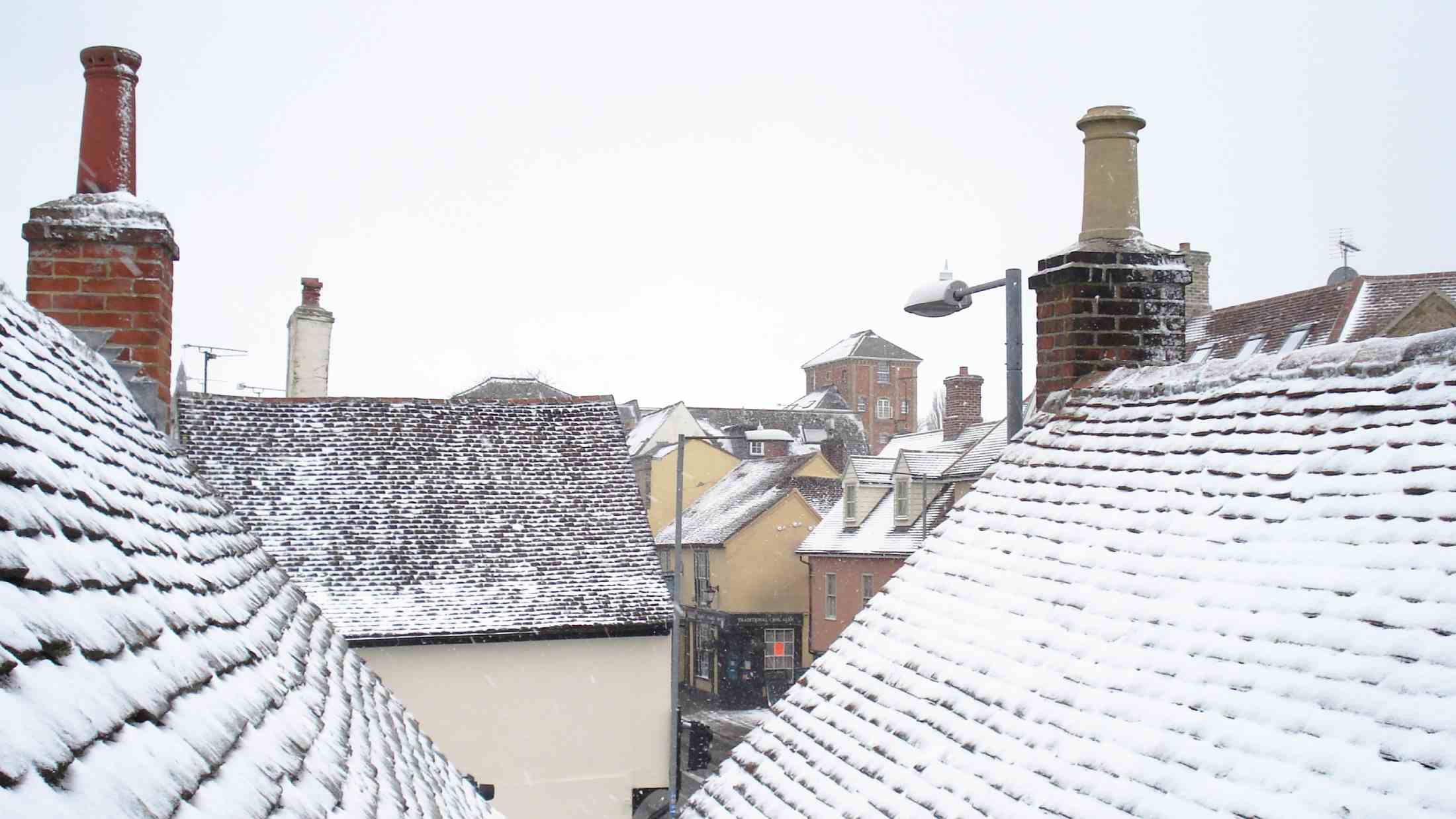 Snow on roofs of homes in a small village